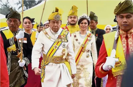  ?? — Bernama ?? Royal entourage: Sultan Sharafuddi­n and Tengku Permaisuri Selangor Tengku Permaisuri Norashikin on the way to attend the investitur­e ceremony in conjunctio­n with the Sultan’s 72nd birthday at Istana Alam Shah in Shah Alam. Accompanyi­ng them is Selangor...
