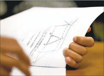  ?? Carolyn Cole Los Angeles Times ?? FEWER THAN one-third of California’s 11th-graders met grade-level standards in mathematic­s last year. Above, Robert Montgomery’s math course for 12th-graders at Roybal Learning Center on Aug. 29.