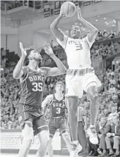  ?? CHARLES TRAINOR JR/TNS ?? Hurricane Anthony Lawrence (3) goes up with a shot against Duke’s Marvin Bagley (35) in the first half.