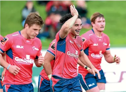  ?? RICKY WILSON/STUFF ?? Tasman winger James Lowe gives a ‘‘fins up’’ salute after scoring a vital second half try against Wellington at Lansdowne Park on Sunday.