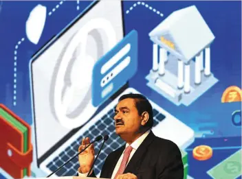  ?? — AFP ?? Capital support: Adani, through his flagship company Adani Enterprise­s Ltd, is seeking to raise 200 billion rupees (Us$2.5bil or Rm11.3bil) by selling new shares. The additional firepower may come in handy to beef up its fledgling super-app.