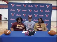  ?? MARK PEREZ-KRYWANY — FOR THE MORNING JOURNAL ?? Oberlin defensive end Isaac Thompson signed his letter of intent to play college football for Walsh University on March 17.