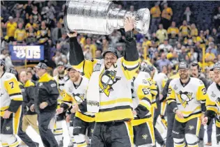  ?? AP PHOTO ?? Pittsburgh Penguins’ Sidney Crosby (87) celebrates with the Stanley Cup after defeating the Nashville Predators in Game 6 of the NHL hockey Stanley Cup Final in Nashville, Tenn., on June 11, 2017. Will the Pittsburgh Penguins create a dynasty with a...