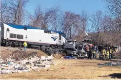  ?? ALLISON WRABEL/THE DAILY PROGRESS ?? Emergency personnel work at the scene of a crash involving a train carrying Republican lawmakers and a garbage truck in Crozet, Va., on Wednesday.