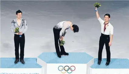  ?? Photo: Reuters ?? National hero: Japan’s Yuzuru Hanyu (centre) is overcome with emotion after winning his nation’s first ever Olympic figure skating title in Sochi, while Canadian Patrick Chan (left) and Kazakhstan’s Denis Ten look on.