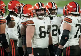  ?? SETH WENIG - THE ASSOCIATED PRESS ?? FILE - Cleveland Browns center JC Tretter (64) talks to teammates during the first half of an NFL football game against the New York Giants on Dec. 20, 2020, in East Rutherford, N.J.