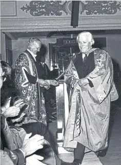  ??  ?? Sir Dingle Foot on the stage in the Caird Hall in 1974 when he was awarded an honorary degree by the University of Dundee. Principal James Drever can be seen in the background. Picture: University of Dundee Archive Services.