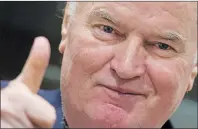  ?? AP PHOTO ?? Bosnian Serb military chief Ratko Mladic flashes a thumbs up as he enters the Yugoslav War Crimes Tribunal in The Hague, Netherland­s, Wednesday.