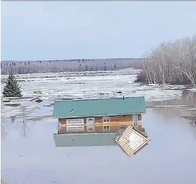  ?? HELEN SANDERSON JENKINS/FACEBOOK ?? An ice jam in the North Saskatchew­an River caused massive flooding in Wapiti Valley Regional Park last weekend.