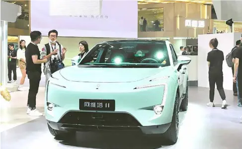  ?? Photo chinadaily.com.cn ?? Avatr, an electric vehicle marque backed by Changan, Huawei and CATL, showcases one of its models at an auto show in China.