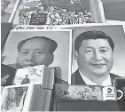  ??  ?? Posters of President Xi Jinping, right, and Mao Zedong. AFP/GETTY IMAGES