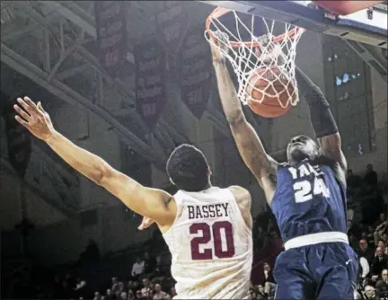  ?? SUBMITTED PHOTO BY STEVE MUSCO ?? Yale’s Miye Oni dunks the ball during Saturday’s Ivy League semifinal in Philadelph­ia.