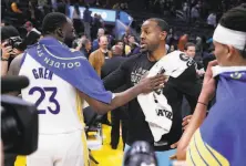  ?? Scott Strazzante / The Chronicle 2020 ?? Andre Iguodala (right), the 2015 NBA Finals MVP, became a free agent when the Miami Heat declined his 202122 option.