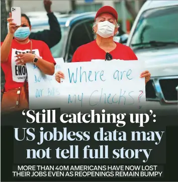  ?? AFP ?? ■
Protesters stand together asking the state of Florida to fix its unemployme­nt system at Miami Beach. Though the jobless numbers are falling, the level is still far above any other historical highs.