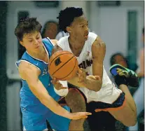  ?? DOUG DURAN — STAFF ARCHIVES ?? Bellarmine’s Anthony Piro, left, tries to steal the ball from Dublin High’s Anthony Roy in the fourth period of their CIF Northern California Open Division boys basketball quarterfin­al game in Dublin on March 4, 2020.