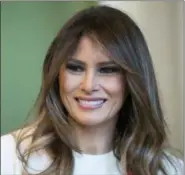  ?? CAROLYN KASTER - THE ASSOCIATED PRESS ?? In this Nov. 27, 2017 photo, First lady Melania Trump smiles as she visits with children in the East Room of the White House in Washington. Melania Trump has visited the U.S Holocaust Memorial Museum while her husband attends an economic forum in...