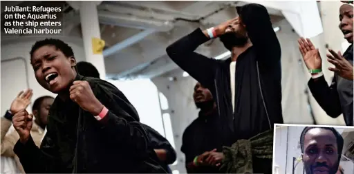  ??  ?? Jubilant: Refugees on the Aquarius as the ship enters Valencia harbour