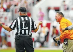  ?? THE ASSOCIATED PRESS ?? Tennessee coach Butch Jones argues with an official about a play during the first half Saturday against Alabama in Tuscaloosa, Ala.