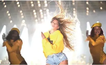  ??  ?? Beyoncé made Coachella-history in 2018, becoming the first woman of colour to headline the music festival. On Sunday, Netflflix tweeted out an announceme­nt that a Beyoncé-related project would be coming to the streaming platform on April 17. The documentar­y 'Homecoming' chronicles the singer's highly-praised performanc­e at Coachella — which was officially dubbed "Beychela" — last year. • (Below) Beyonce performed at the Coachella festival last year. — Relaxnews photo