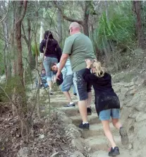  ??  ?? Above right: The track through a natural arch. Below left: Sometimes dad needs a little assistance!