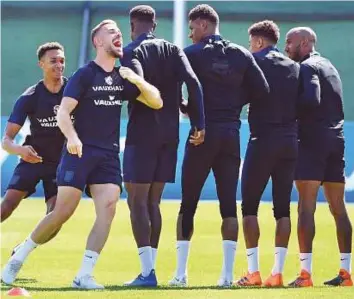  ?? AFP ?? Jordan Henderson (second left) says he will volunteer to take a penalty in any future shootouts.