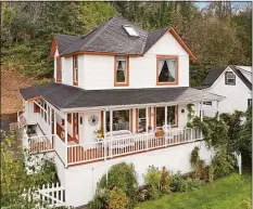  ?? Associated Press ?? The house featured in the Steven Spielberg film “The Goonies” in Astoria, Ore. The Victorian home, built in 1896 with sweeping views of the Columbia River as it flows into the Pacific Ocean, is now for sale has been listed with an asking price of $1.7 million. Since the film was released in 1985, fans have flocked to the home, and the owner has long complained of constant crowds and trespassin­g.