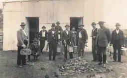  ??  ?? Profession­al ratcatcher­s pose for a photo with their haul in the docks area of Sydney, c.1900. The government paid a bounty of two pence per dead rat.