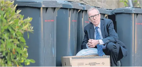  ??  ?? Councillor Fraser Macpherson at the bins on Seabraes Lane where the rats were spotted.