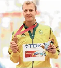  ?? GETTY IMAGES ?? AIMING HIGHER: Bronze medalist Johan Cronje of South Africa stands on the podium during the medal ceremony for the men’s 1 500m at the World Athletics Championsh­ips in Moscow earlier this month.