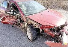  ?? PHOTO SUBMITTED BY GREGG SWEETEN ?? The car that struck a Pineville fire truck sustained significan­t damage. The truck was parked on the shoulder of I-49 to fight a car fire. The fire truck sustained minor damage, with the bumper ripped off.