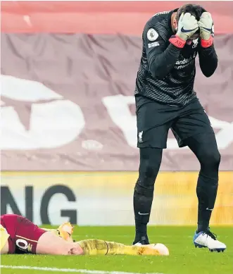  ??  ?? Seeing red: Alisson Becker of Liverpool reacts after fouling Ashley Barnes for the penalty converted by the Burnley striker