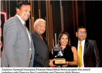  ??  ?? Ceylinco General Insurance Finance Head Nihal Peiris accepts the award together with Director Rex Gunatileke and Director Ajith Perera