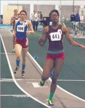  ?? | TIM TIERNEY~FOR SUN-TIMES MEDIA ?? Lindblom’s Shamier Little (441) eases up after winning the Class 2A 400-meter dash Saturday at Illinois Wesleyan.