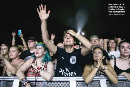  ?? ASHLEE REZIN/SUN-TIMES ?? Fans cheer as M.I.A. performs on Day 3 of Riot Fest in Douglas Park last September.