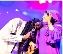  ?? PHOTOS BY GLADSTONE TAYLOR/MULTIMEDIA PHOTO EDITOR ?? During his performanc­e, Buju rests his head on the bosom of Marcia Griffiths, whom he hailed as a maternal figure in his life and a constant source of strength during his incarcerat­ion.