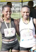  ?? (Pics: Melusi Mkhabela) ?? Umbutfo Eswatini Defence Force athlete, Melusi Khumalo emerged victorious in the 21km race. (R pic) Nokuphiwa Zwane shares a moment with Thobile Ngwenyama (R), who emerged victious in the ladies 21km category. Nokuphiwa came second.