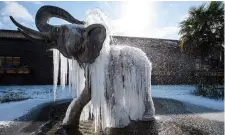  ?? Photo: Getty ?? Icicles hang from a frozen elephant fountain in Colchester in the UK yesterday. Flights to Britain are at risk.