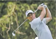  ?? REBECCA BLACKWELL/THE ASSOCIATED PRESS ?? Rory McIlroy shot at 9-under 133, two shots ahead of Phil Mickelson (68), Justin Thomas (66) and Ross Fisher (68) on Friday in Mexico City for the Mexico Championsh­ip.