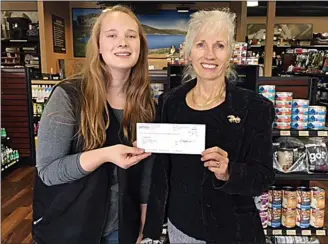  ?? — Special to The Herald ?? Penticton Bosley’s pet store assistant manager Emma Beauchamp presents cheque $1,743 AlleyCATS Alliance representa­tive Theresa Nolet. The money was raised during their 2018 PAW Event – Pet Appreciati­on Month. Thanks to the generosity of businesses like Bosley’s, AlleyCATS has been able to help 1,400-plus cats since 2012. a for to