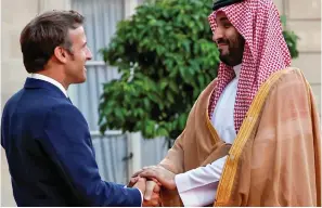  ?? ?? Handshake: Emmanuel Macron with Prince Mohammed last night