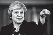  ?? MATT DUNHAM/GETTY-AFP ?? British Prime Minister Theresa May answers a question about the Brexit draft agreement Thursday in London.