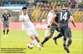  ??  ?? Players of Iran and Germany vie for the ball during their FIFA U-17 football match at Margao