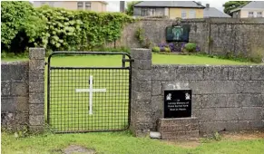  ??  ?? The entrance to the site of a mass grave of hundreds of children who died at a former home for unmarried mothers in Galway.