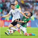  ?? MARTIN MEISSNER/ASSOCIATED PRESS ?? Germany’s Leon Goretzka, left, is fouled by Mexico’s Raul Jimenez during Thursday’s match.