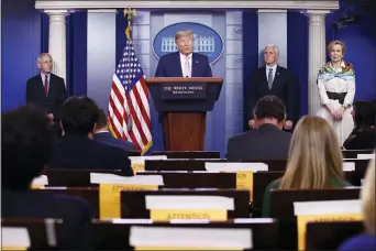  ?? PATRICK SEMANSKY - THE ASSOCIATED PRESS ?? President Donald Trump speaks during a coronaviru­s task force briefing at the White House, Saturday, April 4, in Washington. From left, Dr. Anthony Fauci, director of the National Institute of Allergy and Infectious Diseases, Trump, Vice President Mike Pence and Dr. Deborah Birx, White House coronaviru­s response coordinato­r.