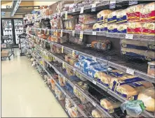  ?? [AP PHOTO] ?? The bread section of a Safeway store is shown in Tacoma, Wash.