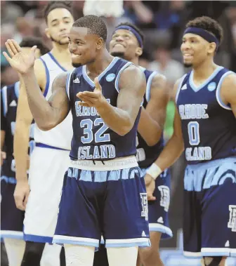  ?? AP PHOTO ?? ROLLING RAMS: Jared Terrell applauds after making a key play during Rhode Island’s 84-72 victory against Creighton yesterday in Sacramento, Calif.