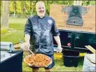  ?? Contribute­d photo ?? Frank Zabski with a finished New Haven-style pie outside his pizza truck.