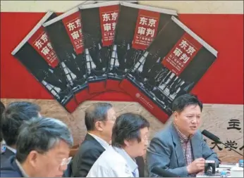  ?? GAO ERQIANG / CHINA DAILY ?? Cheng Zhaoqi, author of and director of Shanghai Jiao Tong University’s Center for the Tokyo Trial Studies, speaks at the premiere of the book at the university on Tuesday.