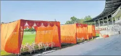  ?? DEEPAK GUPTA/HT PHOTOS ?? (Clockwise) Vaccinatio­n booths being set up at Lucknow’s KD Singh ‘Babu’ Stadium; officials reviewing arrangemen­ts at Atal Bihari Vajpayee Ekana stadium on Monday and locals being given the jabs at a camp at Nadhira village in Sonbhadra.